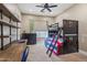 Bedroom with custom built in bunk beds, industrial shelves and natural lighting at 27582 N 67Th Way, Scottsdale, AZ 85266