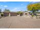 Charming single-story home with three-car garage and desert landscaping at 27582 N 67Th Way, Scottsdale, AZ 85266