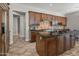 Kitchen featuring dark wood cabinets, granite countertops, and a chef-style stove at 27582 N 67Th Way, Scottsdale, AZ 85266