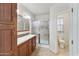 Bathroom with double sinks and tiled shower at 2929 E Main St # 135, Mesa, AZ 85213