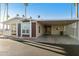 Home exterior featuring a covered carport and front porch, perfect for outdoor enjoyment at 2929 E Main St # 135, Mesa, AZ 85213