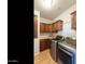 Well-lit laundry room featuring wood cabinets and modern machines at 2929 E Main St # 135, Mesa, AZ 85213