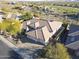 Gorgeous aerial view of a home showcasing a tile roof and desert landscaping in a golf course community at 3109 W Summit Walk Ct, Anthem, AZ 85086