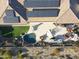 An aerial view of a home with solar panels, a pool, and a built-in outdoor kitchen at 3109 W Summit Walk Ct, Anthem, AZ 85086