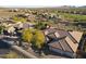 A nice aerial shot of a home with desert landscaping in a neighborhood near a golf course at 3109 W Summit Walk Ct, Anthem, AZ 85086