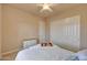 Bedroom featuring a ceiling fan, closet, and dresser with comfortable bedding at 3109 W Summit Walk Ct, Anthem, AZ 85086