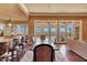 Stylish dining room with an open concept, hardwood floors, and beautiful outdoor views at 3109 W Summit Walk Ct, Anthem, AZ 85086