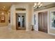 Grand foyer showcasing tile flooring, decorative doors, chandelier, and architectural details at 3109 W Summit Walk Ct, Anthem, AZ 85086