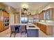 Modern kitchen featuring granite countertops, wood cabinets, and stainless steel appliances at 3109 W Summit Walk Ct, Anthem, AZ 85086