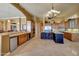 Spacious kitchen with wooden cabinets, an island with seating, and stainless steel appliances at 3109 W Summit Walk Ct, Anthem, AZ 85086