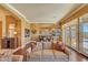 Comfortable living room with hardwood floors and an open layout leading to the kitchen and patio at 3109 W Summit Walk Ct, Anthem, AZ 85086