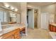 A spacious main bath featuring a double sink vanity, soaking tub and glass block enclosed shower at 3109 W Summit Walk Ct, Anthem, AZ 85086