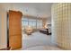 Spacious main bedroom featuring a sitting area, light-filled windows, and stylish glass block partition at 3109 W Summit Walk Ct, Anthem, AZ 85086