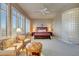 Bright main bedroom with large windows, cozy seating, and elegant furnishings for a relaxing atmosphere at 3109 W Summit Walk Ct, Anthem, AZ 85086