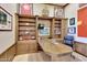 Office with a desk, bookcase, sports decor, and a comfortable workspace setup at 3109 W Summit Walk Ct, Anthem, AZ 85086