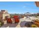 Expansive patio featuring an outdoor kitchen, fireplace, pool, and relaxing lounge area at 3109 W Summit Walk Ct, Anthem, AZ 85086