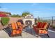 Inviting outdoor living space with a cozy fireplace and comfortable seating area at 3109 W Summit Walk Ct, Anthem, AZ 85086