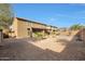 Large backyard with palm trees and a view of the two-story house at 3111 W Pleasant Ln, Phoenix, AZ 85041