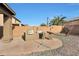 Backyard grill and bar area with palm trees at 3111 W Pleasant Ln, Phoenix, AZ 85041