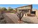 Wide backyard with built-in grill and bar area and palm trees at 3111 W Pleasant Ln, Phoenix, AZ 85041