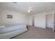 Carpeted bedroom with closet and connecting room, offering space and functionality at 3111 W Pleasant Ln, Phoenix, AZ 85041