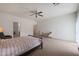 Huge bedroom with neutral colors and a ceiling fan at 3111 W Pleasant Ln, Phoenix, AZ 85041