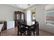 Dining area featuring a solid table with seating and a view to backyard at 3111 W Pleasant Ln, Phoenix, AZ 85041