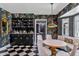 Stylish dining room with floral wallpaper, built-in bar and sleek, modern lighting at 3702 E Camelback Rd, Phoenix, AZ 85018