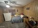 Cozy bedroom with ceiling fan, carpet flooring and built-in shelving at 4065 E University Dr # 517, Mesa, AZ 85205