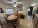 Cozy dining area featuring a classic wooden table set under a charming ceiling fan at 4065 E University Dr # 517, Mesa, AZ 85205