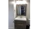 Well-lit bathroom featuring a modern vanity with a framed mirror and neutral color palette at 4112 N 11Th St, Phoenix, AZ 85014