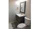 Nicely remodeled bathroom with a modern vanity, framed mirror, and tiled floor with a toilet at 4112 N 11Th St, Phoenix, AZ 85014