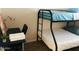 Cozy bedroom featuring a bunk bed, desk, and ample space for relaxation and study at 4112 N 11Th St, Phoenix, AZ 85014