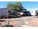 Exterior view of container home featuring stone walkway, shade tree and outdoor seating areas at 4112 N 11Th St, Phoenix, AZ 85014