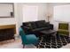 Inviting living room featuring a decorative fireplace, patterned rug, and comfortable seating at 4112 N 11Th St, Phoenix, AZ 85014