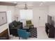 Comfortable living room featuring a ceiling fan, an area rug, and natural light at 4112 N 11Th St, Phoenix, AZ 85014