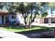 Spacious yard featuring mature shade trees and gravel ground cover at 4112 N 11Th St, Phoenix, AZ 85014