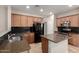 Kitchen with island, stainless steel appliances, granite countertop, and stylish tile backsplash at 46072 W Barbara Ln, Maricopa, AZ 85139