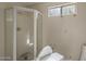 Bathroom with glass shower stall and tile surround at 5345 E Mclellan Rd # 83, Mesa, AZ 85205