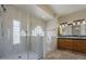 Bathroom featuring a modern shower, a tub, and double vanities with wood cabinets at 5345 E Mclellan Rd # 83, Mesa, AZ 85205