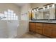 Bathroom with a large tub, double sink vanity, and glass block windows for light at 5345 E Mclellan Rd # 83, Mesa, AZ 85205