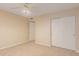 Bedroom featuring carpet floors, a ceiling fan and a closet with sliding doors, maximizing space and functionality at 5345 E Mclellan Rd # 83, Mesa, AZ 85205