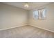 Neutral bedroom featuring beige walls, carpet, and a window for natural light at 5345 E Mclellan Rd # 83, Mesa, AZ 85205