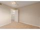 Bedroom featuring carpet floors and a closet with shelving, providing ample storage and a comfortable living space at 5345 E Mclellan Rd # 83, Mesa, AZ 85205