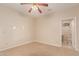 Cozy bedroom with ceiling fan that leads to an en-suite bathroom for added convenience at 5345 E Mclellan Rd # 83, Mesa, AZ 85205