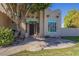 Close up of charming single-story home with a unique walkway and mature landscaping at 5345 E Mclellan Rd # 83, Mesa, AZ 85205