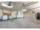 Spacious garage with ample storage cabinets along the wall and concrete flooring at 5345 E Mclellan Rd # 83, Mesa, AZ 85205