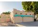 Spacious three-car garage featuring a Southwestern-style design and desert landscaping at 5345 E Mclellan Rd # 83, Mesa, AZ 85205