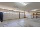 Two car garage with a clean concrete floor, shelving, and two garage doors at 5345 E Mclellan Rd # 83, Mesa, AZ 85205