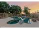 Backyard pool and hot tub surrounded by lush greenery, perfect for relaxation and entertaining at 5345 E Mclellan Rd # 83, Mesa, AZ 85205